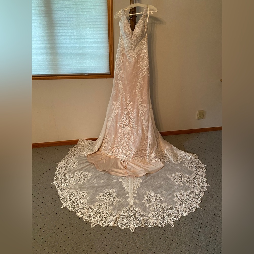 New with tags, never worn or altered, ivory/nude boutique wedding dress